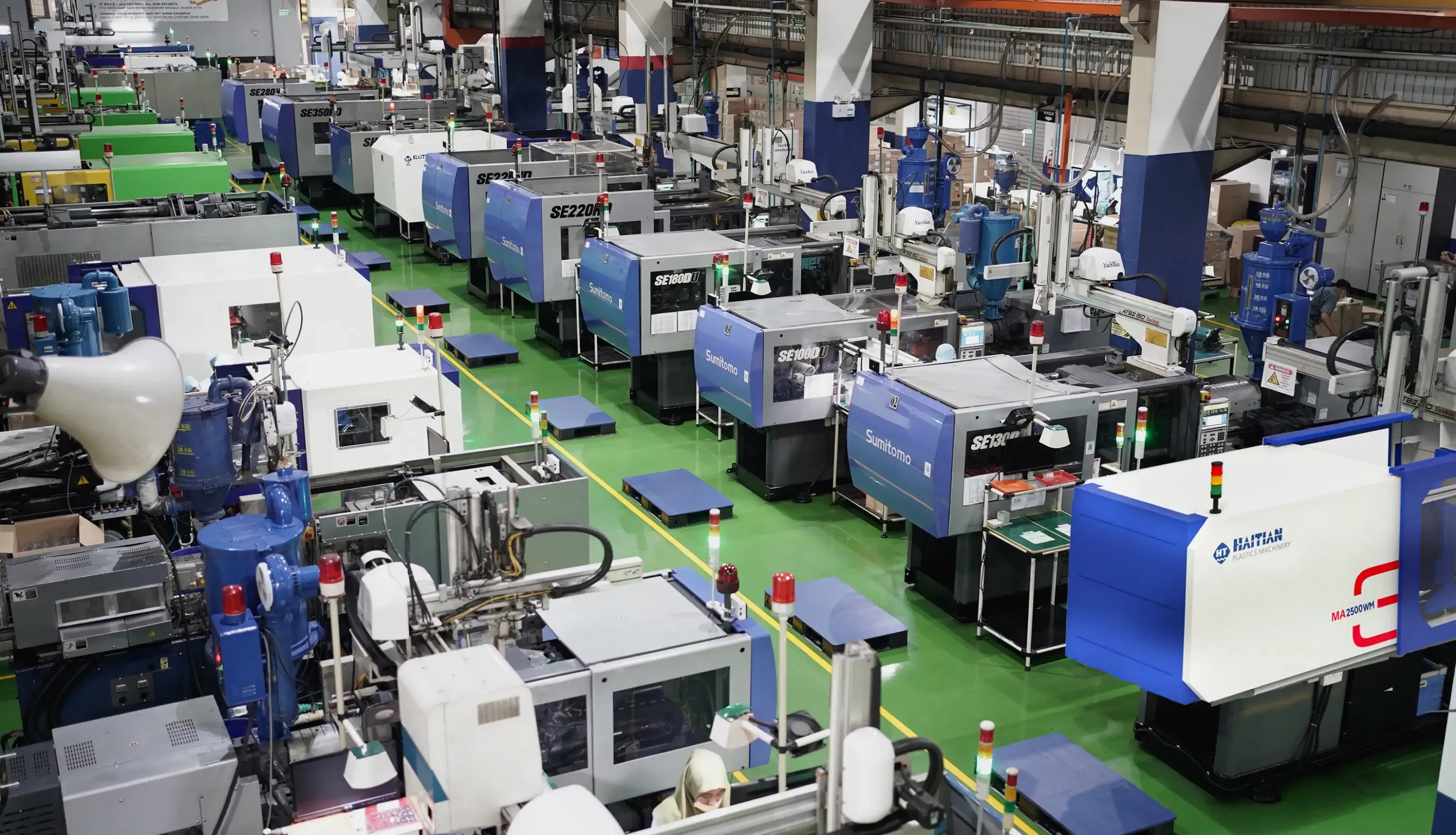 Advanced Precision Injection facility at Sat Nusapersada showing precision manufacturing equipment